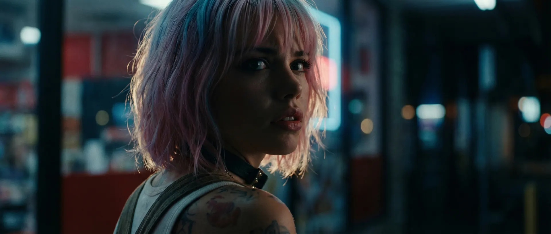 Vex glances back over her shoulder on a dim, neon-blurred street.
