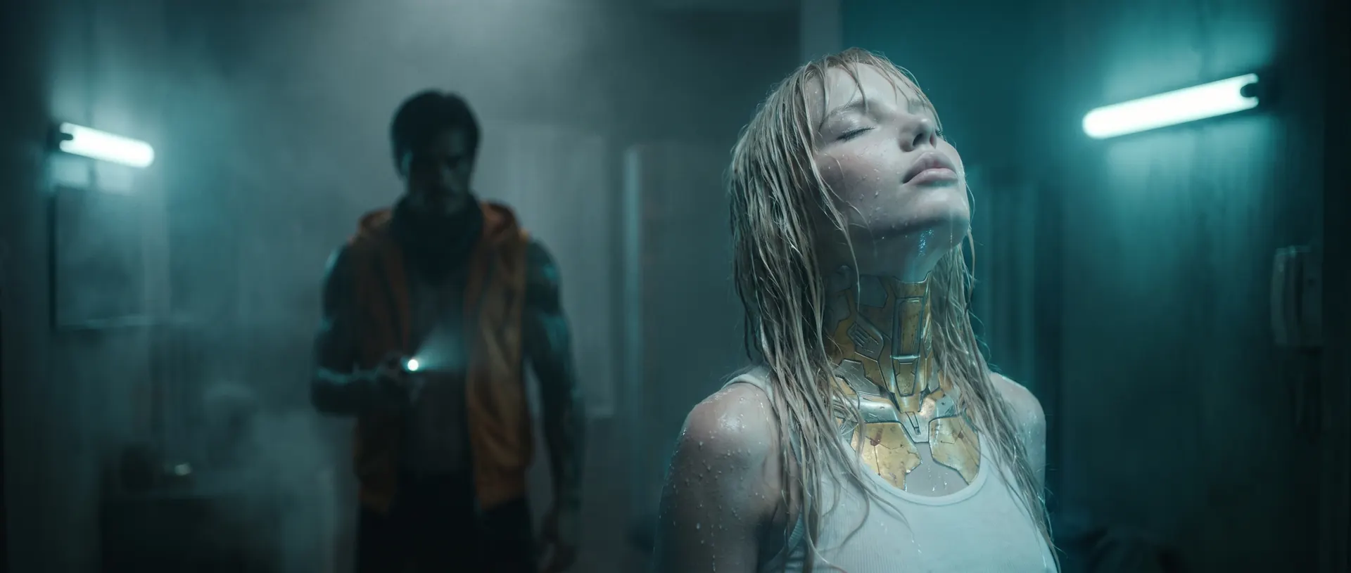 Exe, soaked, tilts her head back with her eyes closed as Neon stands behind her with a torch.